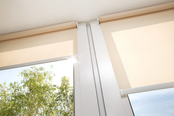 Roll textile jalousie Window with sand coloured roll sun blinds